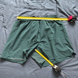 LULULEMON MEN SHORTS, large no pockets except rear. 5" inseam.